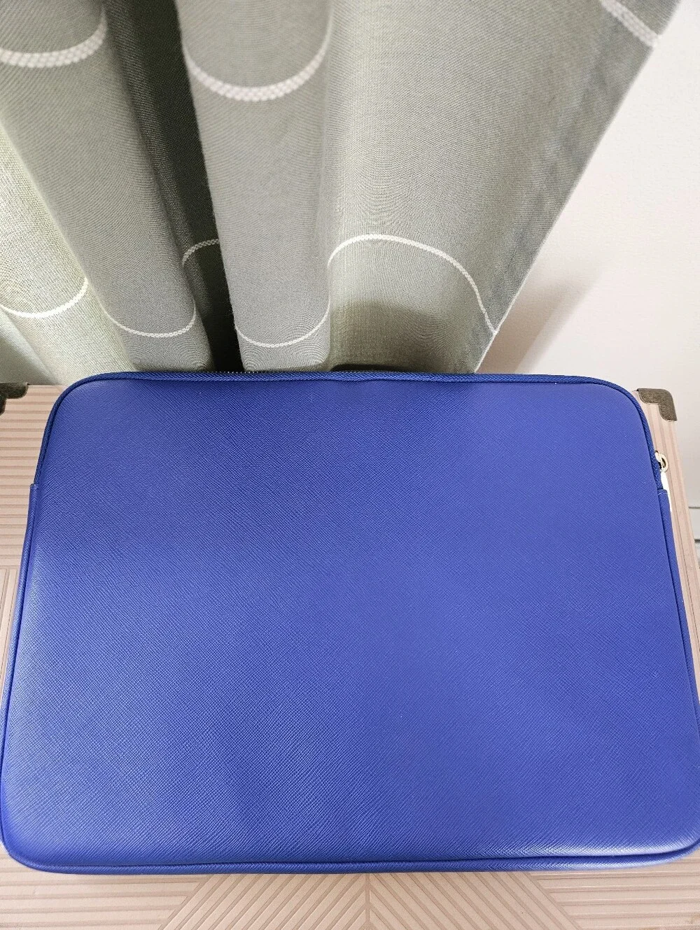 kate spade cobalt blue laptop sleeve with gold logo plaque